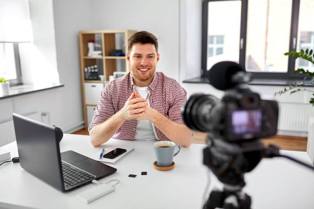 Content marketer in front of a camera